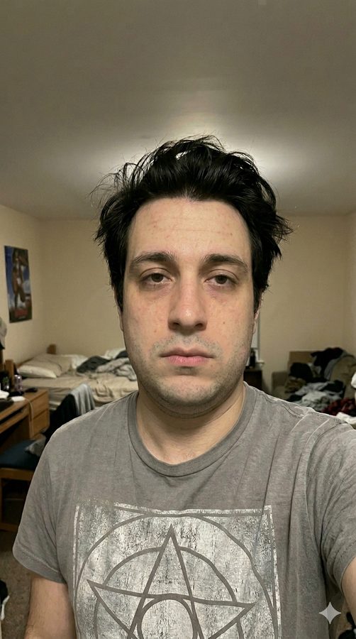 Before-style selfie — soft features, dim lighting, tired read